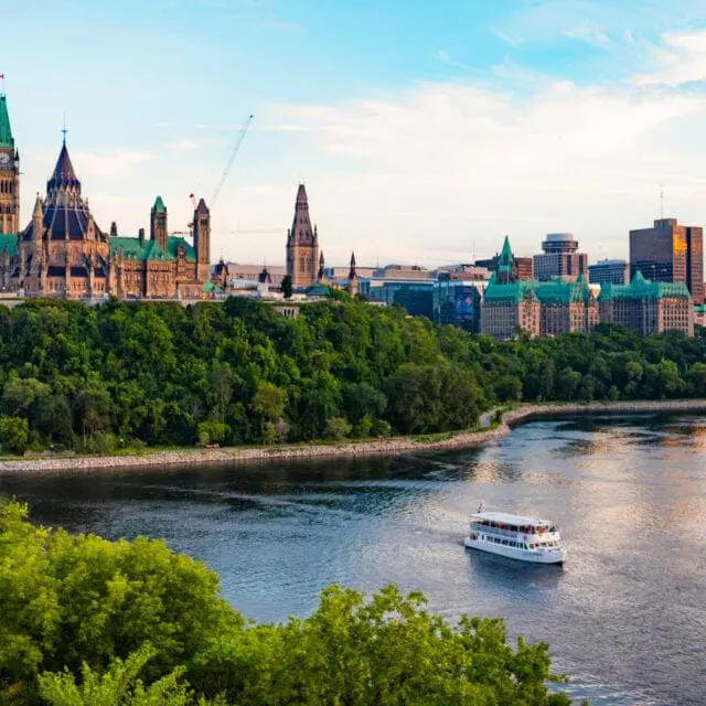 The rear of Parliament Hill is visible from the Ottawa River.