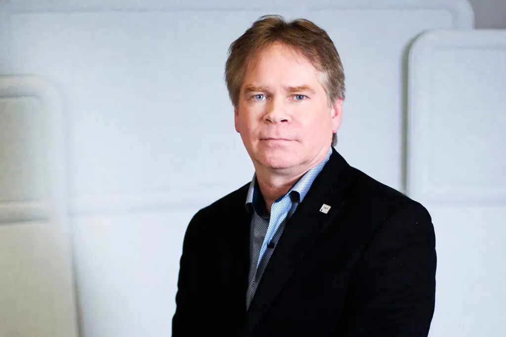 Headshot of Neil Butters, Director, Products & Platforms at Interac