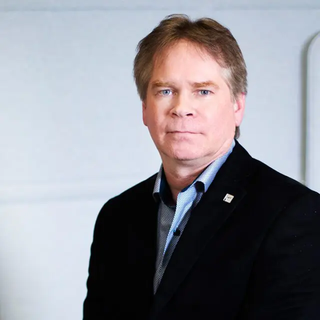 Headshot of Neil Butters, Director, Products & Platforms at Interac