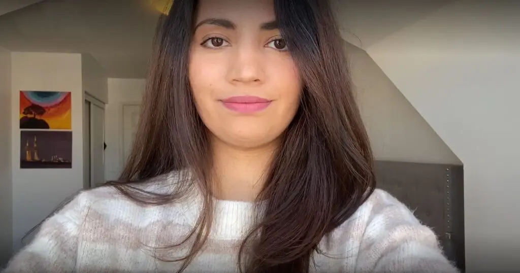 Female Interac employee looking confidently into the camera.