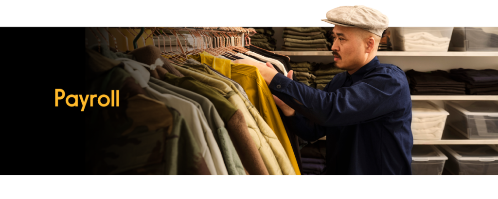 An employee looking through coat selections