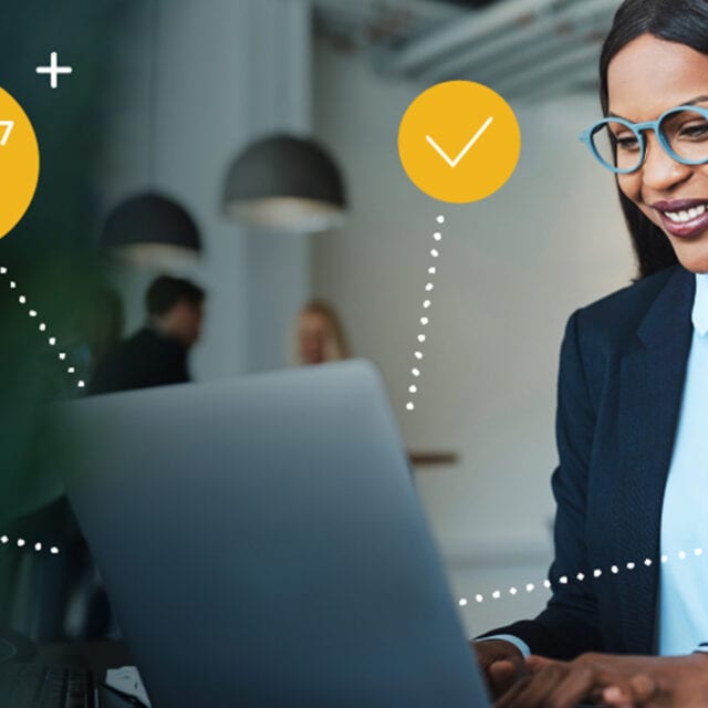 A woman in a suit with laptop is surrounded by icons representing faster business payment processing