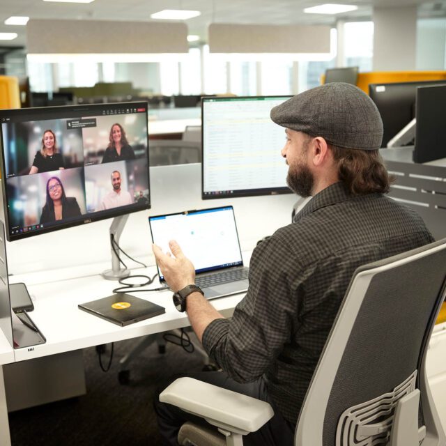 hybrid fintech employee having virtual meeting at an employer of choice in an office in Canada