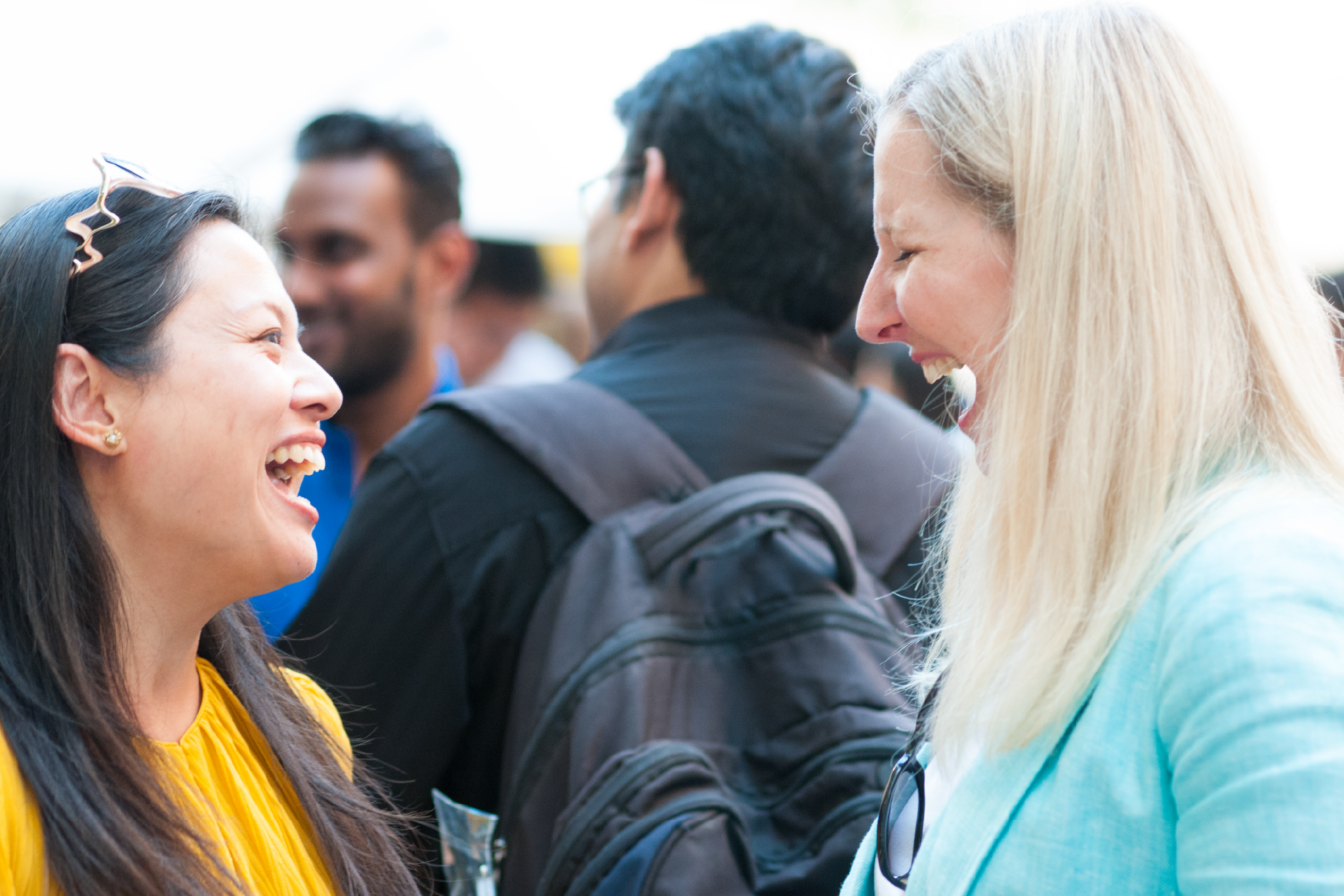 Two Interac employees laughing together.