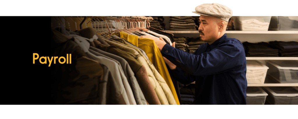 An employee looking through coat selections