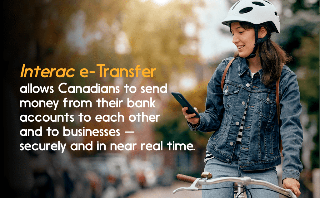 Photo of cyclist looking at smartphone. Quote: INTERAC e-Transfer allows Canadians to send money…